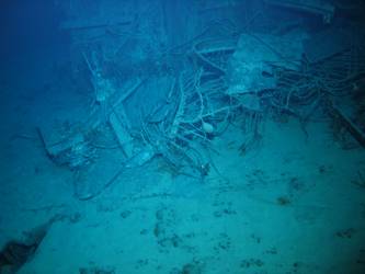 Wire mesh and twisted metal in debris field